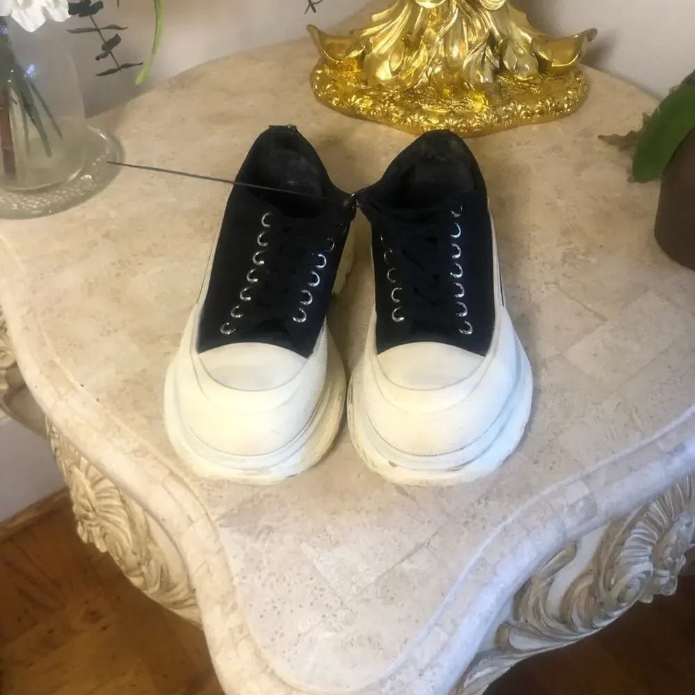 Alexander McQueen black and white platform chucks.